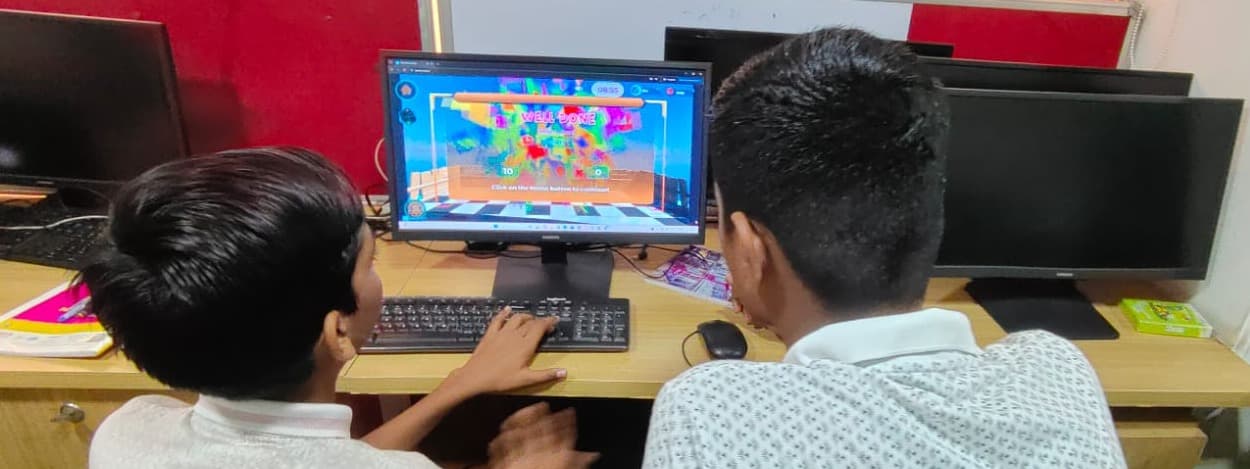 Students, seen from behind, reach a completion screen in Learnverse.